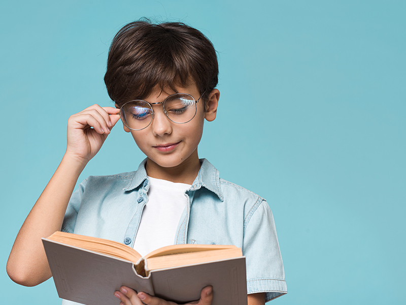 young-boy-reading-with-copy-space